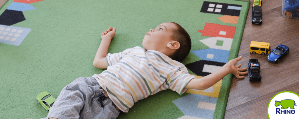 Boy lying on mat