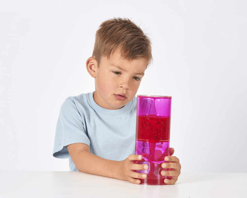 Boy watches the goo ooze through the tube
