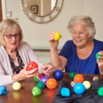 Care home residents exploring their senses with the Sensory Ball Pack