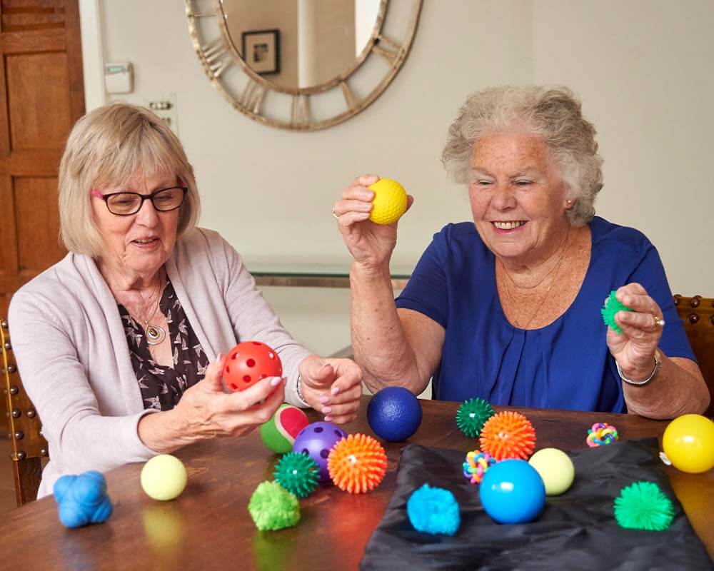 Care home residents exploring their senses with the Sensory Ball Pack