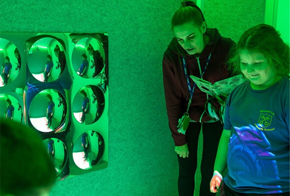 Teacher and students engaging in the sensory trailer