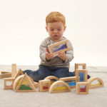 Young boy exploring his tactile senses with sensory blocks