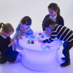 Children playing with the Sensory Mood Table