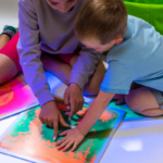 Children exploring their senses with UV Sensory Liquid Floor Tiles