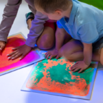 Children playing with UV Sensory Liquid Floor Tiles