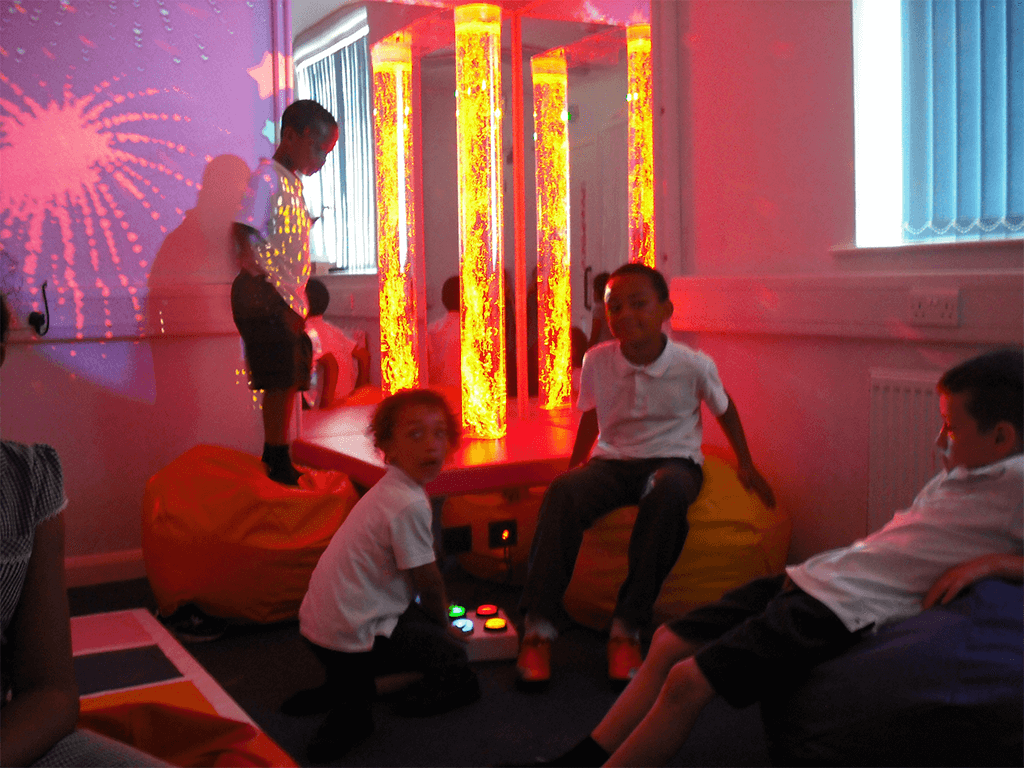 school children playing in a multi-sensory room