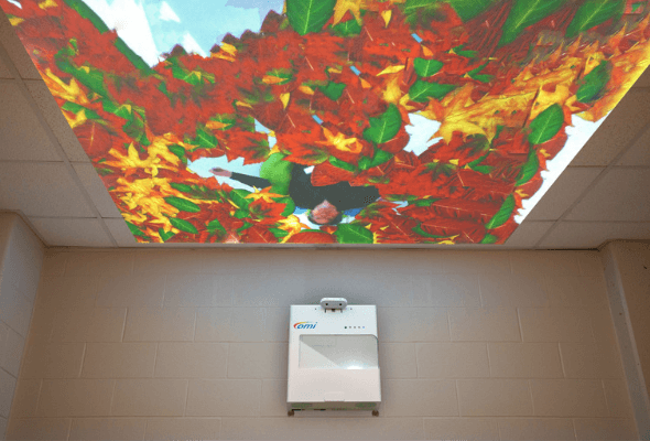 omiSky interactive projector installed on a wall.
